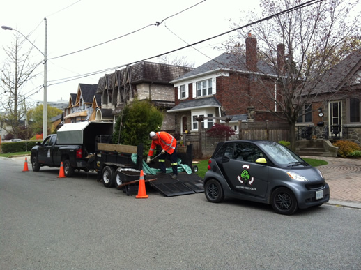 Image of an ETC crew member preparing to plant some trees