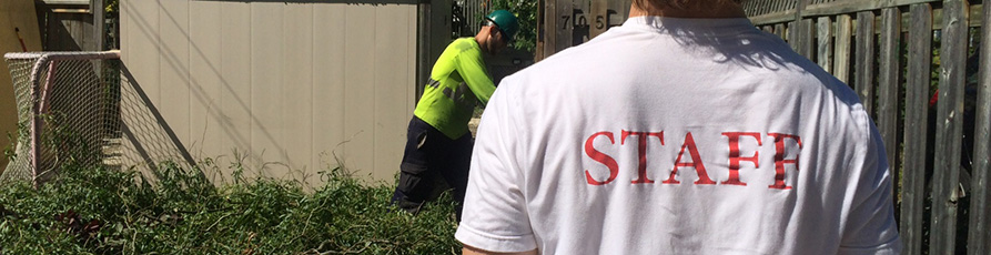 Image of 2 staff members in a yard